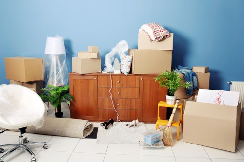 Professional movers handling office equipment